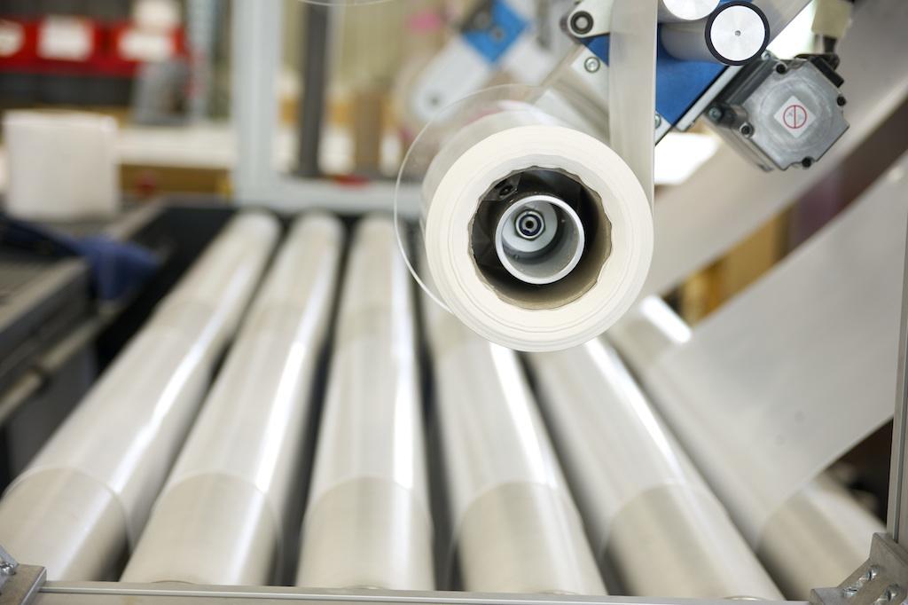 Close-up of a foil cutting machine in our large production hall Aub by Rothschenk